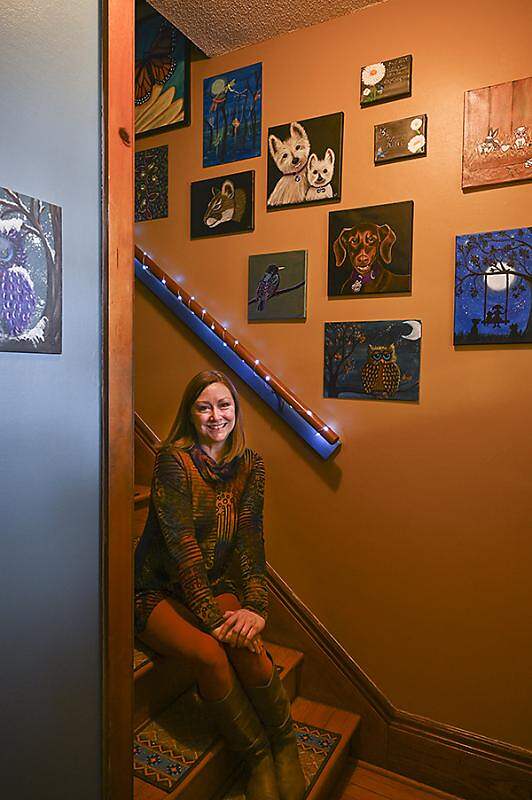 owner in stairwell of home