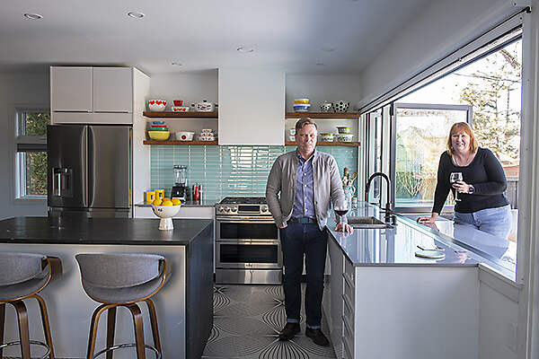 couple in kitchen of home