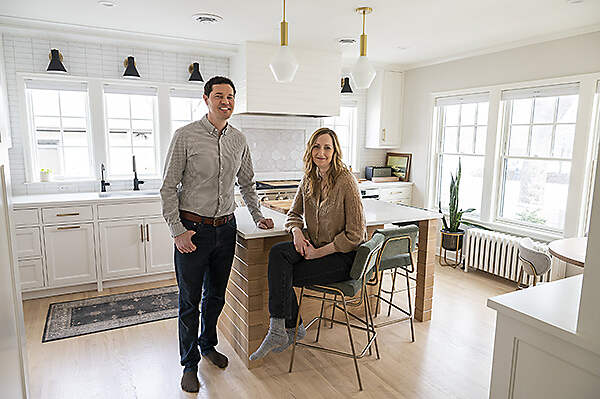 owners sitting at kitchen island