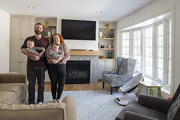 family in remodeled living area, couple with two kids