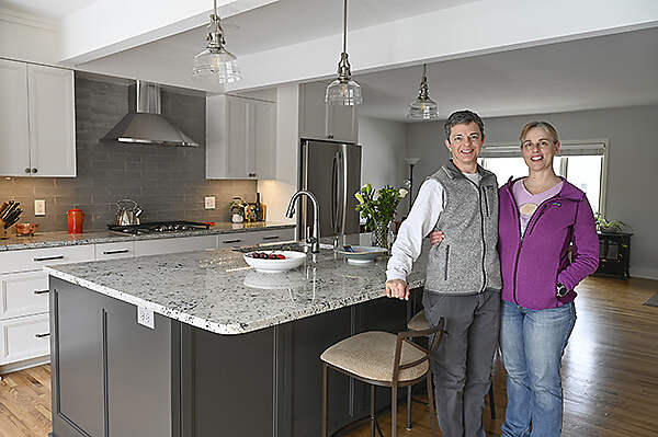 owners in remodeled kitchen