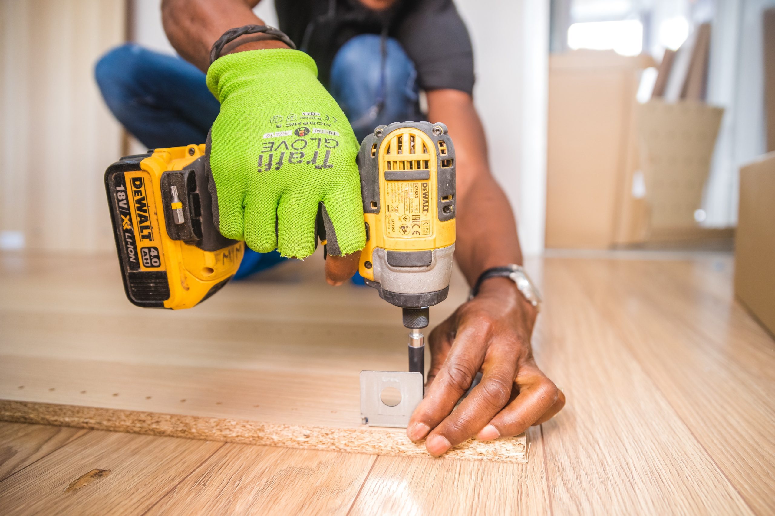 drill screwing into wood floor